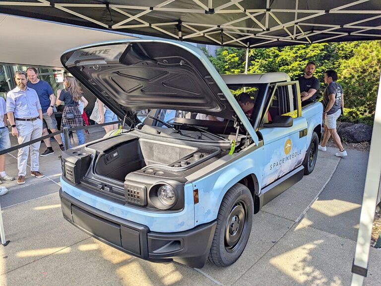 Slate Truck demonstration at Seattle event with the hood open beneath the Space Needle
